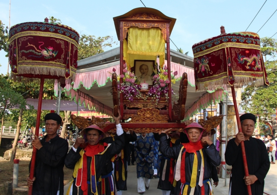 A procession honoring Uncle Ho at a festival held in Duong No